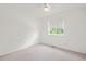 Bedroom with neutral carpet, a ceiling fan and a window with a view at 10890 Depew Pl, Broomfield, CO 80020
