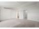 Spacious bedroom with carpet, closet, and en-suite bathroom at 10890 Depew Pl, Broomfield, CO 80020