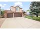Charming two-story home featuring a spacious driveway and a two-car garage at 10890 Depew Pl, Broomfield, CO 80020