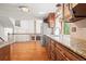 Gourmet kitchen featuring hardwood floors, modern appliances, and ample counter space at 10890 Depew Pl, Broomfield, CO 80020