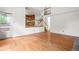 Open-concept living space with hardwood floors and staircase leading to upper level at 10890 Depew Pl, Broomfield, CO 80020