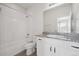 Clean bathroom with granite countertop, a white tub/shower combination, and modern fixtures at 12270 Karls Ln, Northglenn, CO 80241