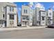 Modern three-story home featuring stone accents, tall windows, and a welcoming curb appeal at 12270 Karls Ln, Northglenn, CO 80241