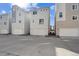 Modern townhome exterior showcases a clean design, private garage, and contemporary appeal at 12270 Karls Ln, Northglenn, CO 80241