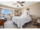 Cozy bedroom featuring a comfortable bed, natural light, and neutral decor at 3336 White Oak Ln, Highlands Ranch, CO 80129