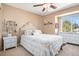 Comfortable bedroom featuring a plush bed, natural light, and classic decor at 3336 White Oak Ln, Highlands Ranch, CO 80129