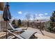 Relax on this private deck with lounge chairs while enjoying the mountain views at 3336 White Oak Ln, Highlands Ranch, CO 80129