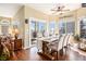 Open dining area with ample natural light, a decorative chandelier and a view to the deck at 3336 White Oak Ln, Highlands Ranch, CO 80129