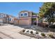 Charming two-story home featuring a brick facade and a well-manicured front yard under blue skies at 3336 White Oak Ln, Highlands Ranch, CO 80129