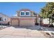 Charming two-story home with a brick-accented facade, a well-manicured lawn, and a two-car garage at 3336 White Oak Ln, Highlands Ranch, CO 80129