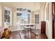 Bright home office featuring a large window with neighborhood views and an adjustable standing desk at 3336 White Oak Ln, Highlands Ranch, CO 80129