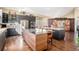 Modern kitchen featuring stainless steel appliances, granite countertops, and a large island with seating at 3336 White Oak Ln, Highlands Ranch, CO 80129