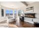 Comfortable sitting room featuring large windows with mountain views and a modern fireplace at 3336 White Oak Ln, Highlands Ranch, CO 80129