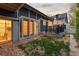Backyard featuring a patio with gray doors and a small grassy area at 561 Cook St, Denver, CO 80206