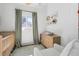 Comfortable Bedroom with a light color scheme, window, and changing table at 561 Cook St, Denver, CO 80206