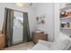 Sun-filled Bedroom highlighting a wooden crib, light chair, and serene decor at 561 Cook St, Denver, CO 80206