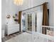 Brightly lit Bedroom with outdoor access and wood laminate flooring at 561 Cook St, Denver, CO 80206