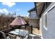Outdoor patio featuring a glass table with chairs and a partially covered space at 561 Cook St, Denver, CO 80206
