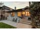 Charming single-story home featuring well-manicured lawn and inviting front patio at 561 Cook St, Denver, CO 80206