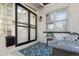 Covered front porch with chairs and an outdoor rug at 561 Cook St, Denver, CO 80206