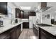 Modern kitchen features stainless steel appliances and marble countertops at 561 Cook St, Denver, CO 80206