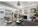 Sunlit living room features a fireplace, skylights, and stylish furnishings at 561 Cook St, Denver, CO 80206