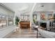 Bright living room with skylight, fireplace, and many windows at 561 Cook St, Denver, CO 80206