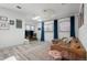 Inviting living room with stylish decor, comfortable seating, bright windows, and a modern aesthetic at 561 Cook St, Denver, CO 80206