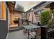 Outdoor patio area with dining table, umbrella, and chairs at 561 Cook St, Denver, CO 80206