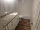 Bathroom featuring a tub, subway tile surround, and granite countertop at 12148 Melody Dr # 108, Denver, CO 80234