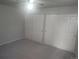 Comfortable bedroom with neutral walls, carpet, ceiling fan, and large closet space at 12148 Melody Dr # 108, Denver, CO 80234