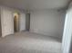 Open concept living room with access to the kitchen and exterior at 12148 Melody Dr # 108, Denver, CO 80234