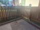 Outdoor patio area with wooden fence, some grass and cement at 12148 Melody Dr # 108, Denver, CO 80234