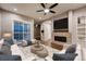 Comfortable living room with fireplace and sliding glass doors, offering a bright and airy space for relaxation at 3703 New Haven Cir, Castle Rock, CO 80109