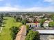 This aerial view showcases the two-story building, parking, and golf course views in the surrounding community at 2150 S Vaughn Way # 302D, Aurora, CO 80014