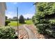 Manicured backyard leads to green space and mature trees, perfect for enjoying the outdoors at 2150 S Vaughn Way # 302D, Aurora, CO 80014