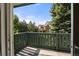 Enjoy serene views from this balcony, surrounded by lush greenery and overlooking well-maintained landscaping at 2150 S Vaughn Way # 302D, Aurora, CO 80014