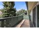 Enjoy the scenery from this balcony framed by mature trees and overlooking the community landscape at 2150 S Vaughn Way # 302D, Aurora, CO 80014