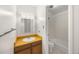 This bathroom features a classic single sink vanity, tiled floor, and a toilet by the shower/tub at 2150 S Vaughn Way # 302D, Aurora, CO 80014