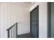Exterior view of a secure front door with a metal security screen and a sturdy handle at 2150 S Vaughn Way # 302D, Aurora, CO 80014