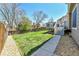 Backyard featuring a green lawn, deck, and privacy fence on a sunny day at 5826 S Jebel Way, Centennial, CO 80015