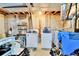 Unfinished basement with washer, dryer, shelving and exposed pipes at 5826 S Jebel Way, Centennial, CO 80015