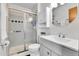 Modern bathroom featuring glass shower door, vanity, and toilet at 5826 S Jebel Way, Centennial, CO 80015