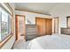 Spacious bedroom featuring carpet flooring, neutral walls, and a view into the bathroom at 5826 S Jebel Way, Centennial, CO 80015
