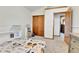 Bright bedroom featuring a closet, neutral carpet, and a fun tractor-themed comforter at 5826 S Jebel Way, Centennial, CO 80015