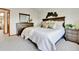Bedroom with large bed, wood furniture, and decorative wall art at 5826 S Jebel Way, Centennial, CO 80015