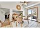 Bright dining area featuring tile floors, slider door, and a decorative round mirror at 5826 S Jebel Way, Centennial, CO 80015