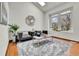Bright living room features a vaulted ceiling, plush rug, and skylight at 5826 S Jebel Way, Centennial, CO 80015