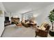 Cozy living room with a brick fireplace, neutral carpet, and comfortable seating area at 5826 S Jebel Way, Centennial, CO 80015