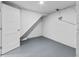 Open basement with painted floor, white walls, access door and overhead lighting at 3630 Magnolia St, Denver, CO 80207
